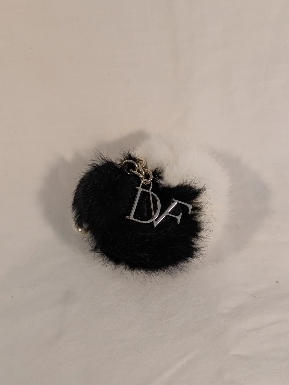 Diane Von Furstenberg Black and White Fur Pom Key Charm